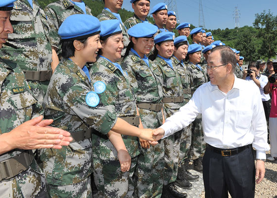 Then UN Secretary-General Ban Ki-moon interacting with Chinese military peacekeepers at the Peacekeeping Center of the MND of the PRC in June, 2013.