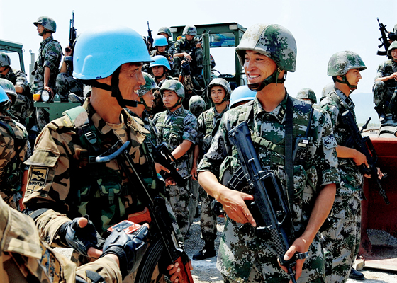 China and Mongolia held a joint peacekeeping exercise in June 2009. Service members from both countries exchanging ideas.