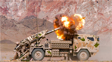 Self-propelled howitzers fire at simulated targets