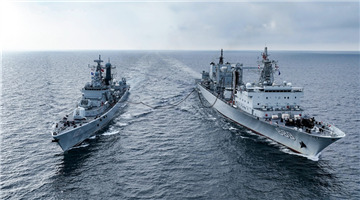 Warships conduct underway replenishment-at-sea