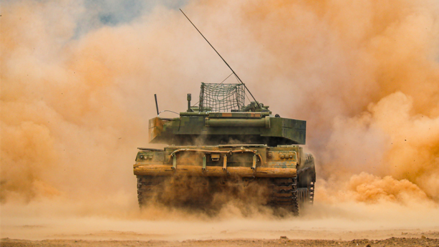 MBT rumbles in smoke and dust