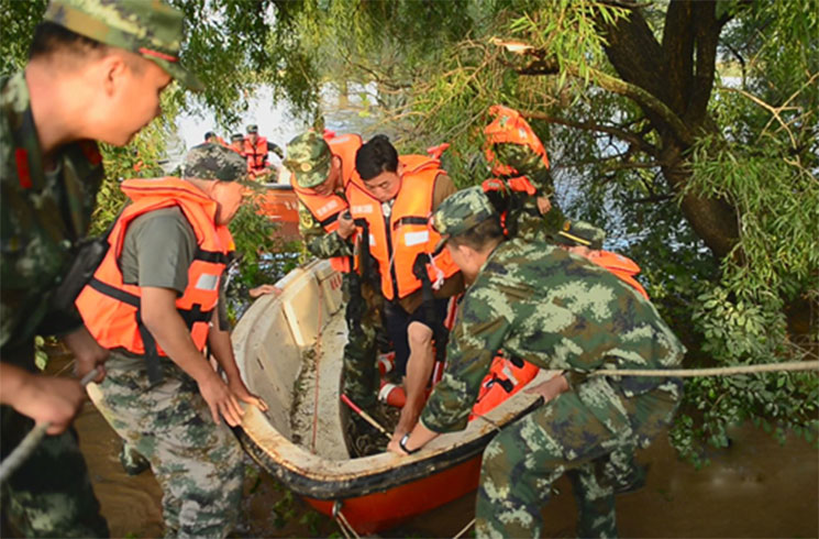 China rescues three trapped in DPRK floods