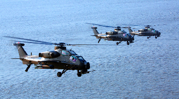 WZ-10 attack helicopters conduct maritime flight training