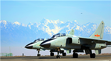 JH-7 fighter bombers fly near Tianshan Mountains