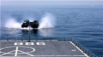LCAC steers into well deck of dock landing ship
