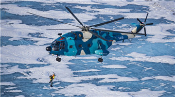 Air force personnel simulate rescue and recovery operations