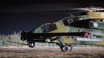 WZ-10 attack helicopters lift off at night