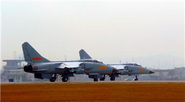 JH-7 fighter bombers take off for flight training