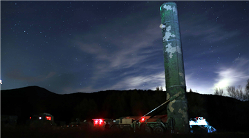 Soldiers practice to erect surface-to-air missile at night