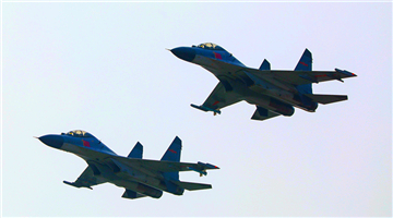 Fighter jets fly alongside each other