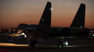Fighter jets rest on tarmac before round-the-clock flight