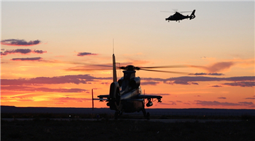 Attack helicopters leave for live-fire flight task