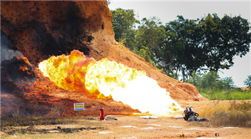Flamethrower burns down targets in attacking drill