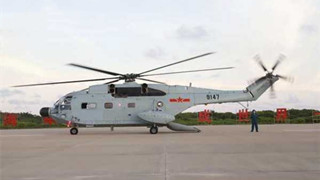 PLA naval helicopter transfers injured building workers at night
